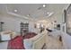Open-concept living room with white sofas and colorful accents at 807 Chipper Dr, Sun City Center, FL 33573