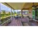 Inviting screened-in patio with outdoor seating overlooking a well-maintained lawn and garden at 807 Chipper Dr, Sun City Center, FL 33573