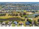 Sprawling aerial view of a residential community with waterfront homes and lush landscaping at 834 Birdie Way, Apollo Beach, FL 33572