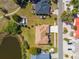 Overhead shot of home with a long driveway, a large backyard, and landscaping at 834 Birdie Way, Apollo Beach, FL 33572