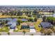 Aerial view of neighborhood with single Gathering homes situated between two lakes at 834 Birdie Way, Apollo Beach, FL 33572