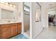Bathroom features a modern vanity, glass shower and walk in closet at 834 Birdie Way, Apollo Beach, FL 33572