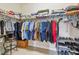 Spacious walk-in closet with ample storage, including shelving, hanging rods, and shoe racks at 834 Birdie Way, Apollo Beach, FL 33572