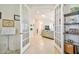 Inviting entryway with French doors leading to a living room, showcasing open floor plan and neutral tones at 834 Birdie Way, Apollo Beach, FL 33572