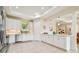 Bright kitchen with white cabinets and stainless steel appliances, creating a modern and inviting space at 834 Birdie Way, Apollo Beach, FL 33572