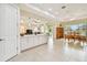 Open-concept kitchen flows into dining area, perfect for entertaining and Gathering gatherings at 834 Birdie Way, Apollo Beach, FL 33572