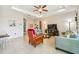 Inviting living room featuring neutral-toned furniture, stylish decor, and abundant natural light from the windows at 834 Birdie Way, Apollo Beach, FL 33572