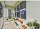 This screened patio boasts a beautiful view and offers plenty of room to enjoy plants and relax at 834 Birdie Way, Apollo Beach, FL 33572