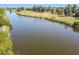 Scenic view of calm lake perfect for walks and peaceful contemplation at 834 Birdie Way, Apollo Beach, FL 33572