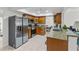 Modern kitchen featuring stainless steel appliances and granite countertops at 8510 King St, Seminole, FL 33772