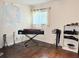Bedroom with wood flooring and a music workspace at 8711 Plum Ln, Temple Terrace, FL 33637