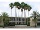The John and Grace Allen Building at the University of South Florida is surrounded by lush landscaping and palm trees at 8711 Plum Ln, Temple Terrace, FL 33637