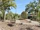 Landscaped gardens and sitting bench at this lovely community at 8711 Plum Ln, Temple Terrace, FL 33637