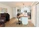 Open-concept view of living space with kitchen, desk and dining areas, and furnishings at 8711 Plum Ln, Temple Terrace, FL 33637