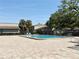 Community swimming pool with brick paver surround and lounge chairs at 8711 Plum Ln, Temple Terrace, FL 33637