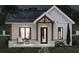 Cozy home with covered porch and neutral color scheme, nestled on a lush lawn at nighttime at 10086 Hilltop Dr, New Port Richey, FL 34654
