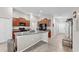 Open kitchen with a large island, granite countertops, wood cabinets and stainless steel appliances at 10205 Cool Waterlily Ave, Riverview, FL 33578