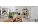 Bright and inviting living room with tile floors, neutral walls, and modern shelving at 10205 Cool Waterlily Ave, Riverview, FL 33578