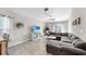 Comfortable living room with modern gray furniture, decorative lighting, and neutral walls at 10205 Cool Waterlily Ave, Riverview, FL 33578