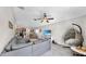 Spacious living room with tile flooring, natural light, and seamless flow to the dining and kitchen areas at 10205 Cool Waterlily Ave, Riverview, FL 33578