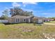 Beautiful single-story home with an attached garage, well-manicured front lawn, and welcoming curb appeal at 10352 Lansfield St, Spring Hill, FL 34608