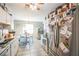 Bright kitchen featuring stainless steel appliances, white cabinets, and a cozy breakfast nook at 10352 Lansfield St, Spring Hill, FL 34608