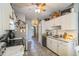 Cozy kitchen featuring white cabinets, stainless steel appliances, and tiled floor at 10352 Lansfield St, Spring Hill, FL 34608
