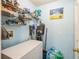 Laundry area with a freezer, storage racks and utility sink at 10352 Lansfield St, Spring Hill, FL 34608