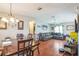 Spacious living room with hardwood floors, comfortable seating, and ample natural light at 10352 Lansfield St, Spring Hill, FL 34608