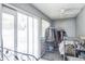 Bright sun room with sliding glass doors and ceiling fan perfect for extra storage at 10352 Lansfield St, Spring Hill, FL 34608