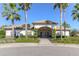 Community clubhouse exterior with lush landscaping, providing a welcoming neighborhood center at 10734 Banfield Dr, Riverview, FL 33579