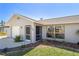 Charming single-story home featuring an attached garage, a screened entry, and manicured landscaping at 1245 Porpoise Rd, Venice, FL 34293