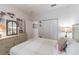 Bright bedroom offers a tranquil retreat with its soothing color scheme and ample closet space at 129 Treviso Ct, North Venice, FL 34275