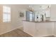 Kitchen featuring bright decor, modern appliances, breakfast bar and ample counter space at 129 Treviso Ct, North Venice, FL 34275