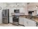 Well-lit kitchen featuring stainless steel appliances, plenty of storage, and ample counter space at 129 Treviso Ct, North Venice, FL 34275
