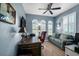 Comfortable office with natural light, a ceiling fan, and space for work and relaxation at 129 Treviso Ct, North Venice, FL 34275