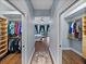 View of the entrance to the main bedroom, flanked by walk-in closets at 13551 Carnoustie Cir, Dade City, FL 33525