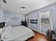 Bedroom featuring hardwood floors, modern fan, and furnishings at 13551 Carnoustie Cir, Dade City, FL 33525