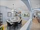 Stylish dining room with modern chandelier, open-concept design, and easy access to living spaces at 13551 Carnoustie Cir, Dade City, FL 33525