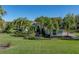 Beautiful one-story home with a tile roof and lush landscaping at 13551 Carnoustie Cir, Dade City, FL 33525