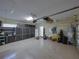 Spacious garage featuring organized storage and ample room for vehicles and projects at 13551 Carnoustie Cir, Dade City, FL 33525