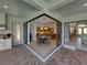 Spacious outdoor patio offering seamless access to multiple indoor living areas at 13551 Carnoustie Cir, Dade City, FL 33525