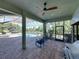 Relaxing screened pool area with comfortable seating and scenic views, perfect for outdoor enjoyment at 13551 Carnoustie Cir, Dade City, FL 33525