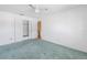 Bedroom features ceiling fan, closet, and stairs at 13982 Whisperwood Dr, Clearwater, FL 33762