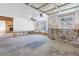 An unfinished living room featuring large windows with backyard and pool view at 13982 Whisperwood Dr, Clearwater, FL 33762