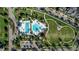 Bird's-eye view showcasing a pool and recreational area with neatly landscaped grounds and surrounding neighborhood at 14123 Barrington Stowers Dr, Lithia, FL 33547