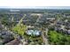 Overhead view of a community showcasing the pool, lake house, and single-Gathering homes in a well-planned neighborhood at 14123 Barrington Stowers Dr, Lithia, FL 33547