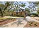Attractive tan-colored clubhouse with covered entry and well-manicured landscaping, perfect for community gatherings at 14123 Barrington Stowers Dr, Lithia, FL 33547