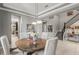 Dining room featuring gray walls and a nearby staircase, creating a spacious and open atmosphere at 14123 Barrington Stowers Dr, Lithia, FL 33547