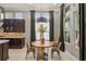 This dining area offers a cozy spot with ample natural light, stylish chairs, and cabinet with backsplash at 14123 Barrington Stowers Dr, Lithia, FL 33547